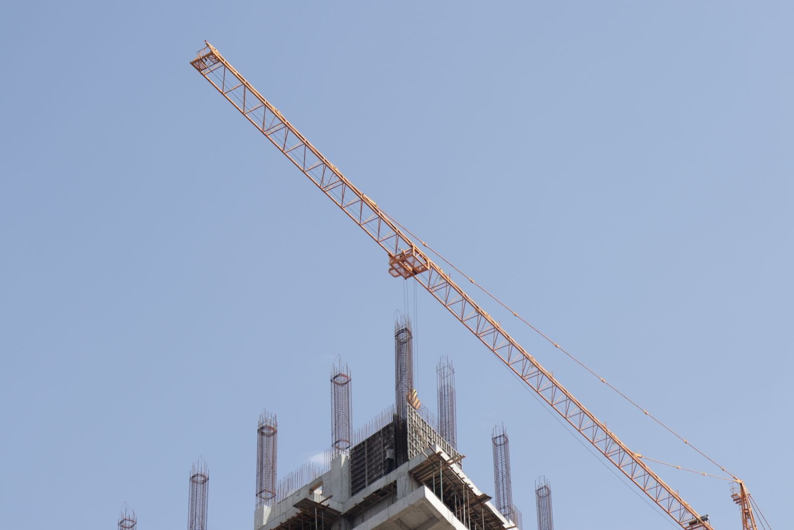Tower crane above a high-rise under construction